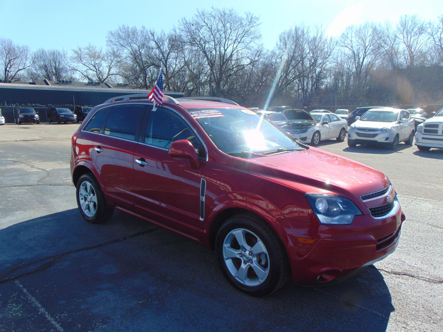 2015 Red Chevrolet Captiva Sport (3GNAL3EK6FS) with an 4-Cyl Flex Fuel 2.4 Liter engine, Automatic, 6-Spd transmission, located at 2105 Dixie Hwy, Louisville, KY, 40210, (502) 772-3333, 38.220932, -85.795441 - Photo#4